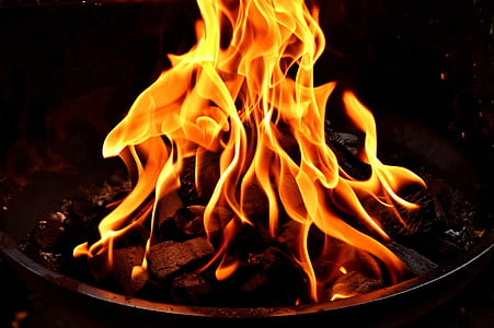 black charcoal with fire at nighttime thumbnail