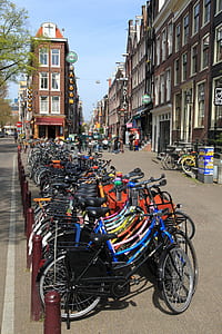 parked assorted bicycles in front of establishment thumbnail