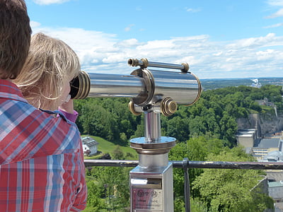 woman using telescope beside man thumbnail
