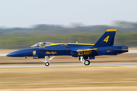 blue and yellow jet plane on brown asphalt during daytime thumbnail