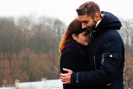 man hugging woman during daytime thumbnail