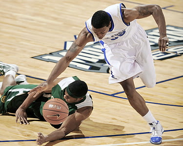 selective focus photo of two basketball players on basketball court thumbnail