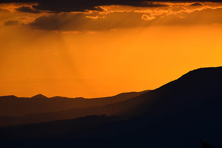 silhouette of mountain with cloudy sky thumbnail