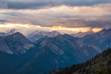 aerial view photography of mountains under clouds thumbnail