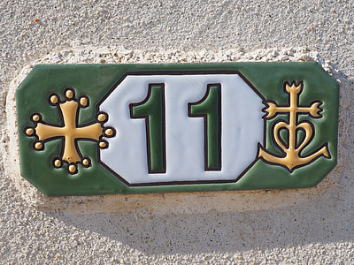close-up photography of green, white, and yellow 11 embossed tile thumbnail