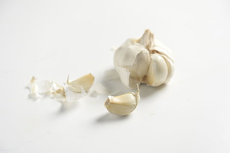 garlic clover on white surface thumbnail