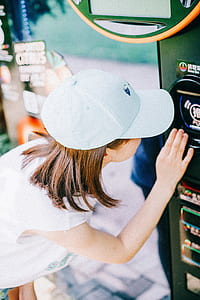 woman in front of vending machine thumbnail