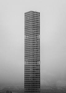 gray high-rise building in grayscale photo thumbnail