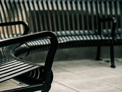 selective focus photography of black metal bench thumbnail