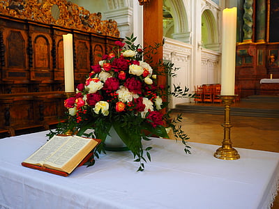 petaled flower arrangement beside bible thumbnail