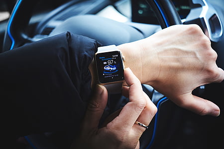 person wearing turned-on Apple Watch inside vehicle thumbnail