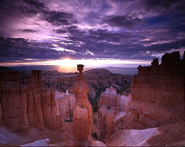 brown mountain cliff during sunset thumbnail