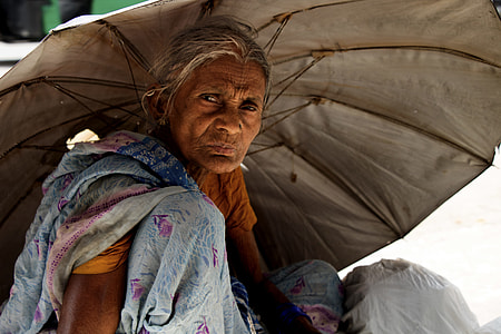 woman under gray umbrella thumbnail