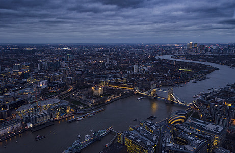cityscape photo under gray clouds thumbnail