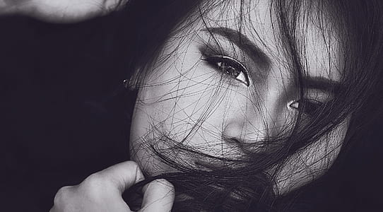 grayscale photo of woman holding chin thumbnail