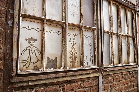 brown concrete brick wall with window paintings thumbnail