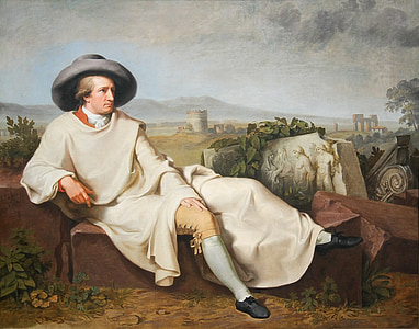 man wearing white top sitting on brown concrete brick painting thumbnail