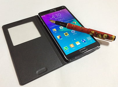 black and red ballpoint pen on black Samsung Galaxy Android smartphone thumbnail