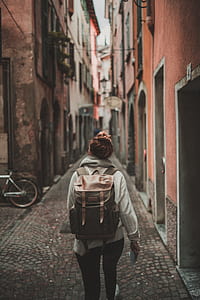 woman walking on alley thumbnail