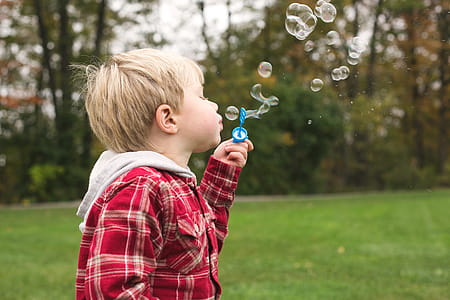 Boy Blowing Bubbles Photo thumbnail