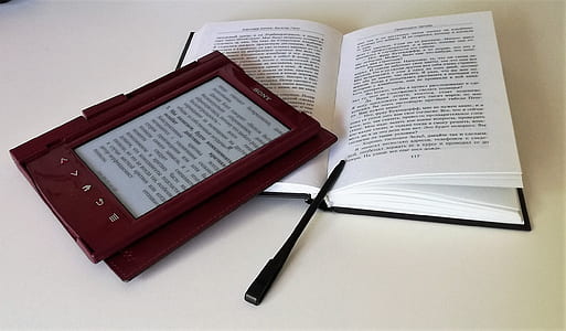 brown e-book reader on opened book thumbnail