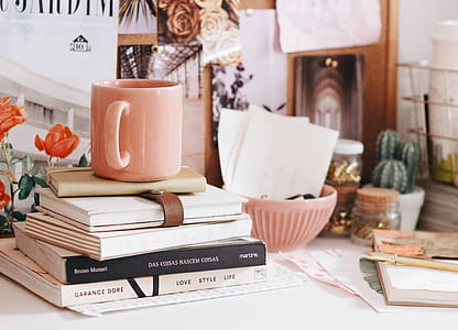 pink ceramic mug on five books thumbnail
