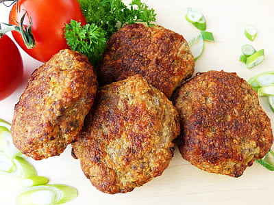 four cooked foods beside red tomato and sliced vegetable thumbnail
