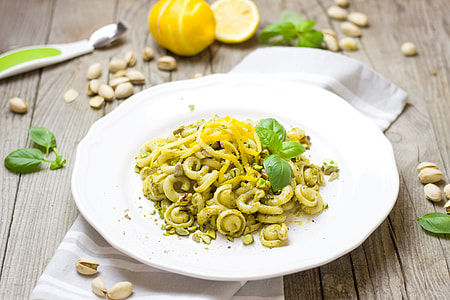 white ceramic plate with green pasta thumbnail