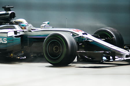 time lapse of white and gray formula 1 on road thumbnail
