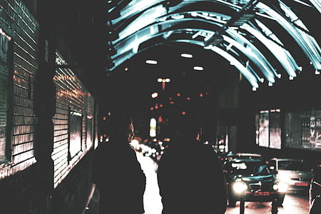 two men standing beside road thumbnail