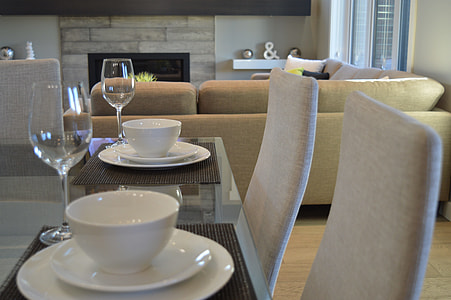 pile of white ceramic bowls, plates and tea cups in room thumbnail