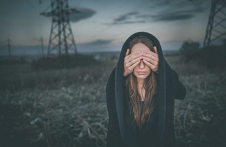 woman holding her eyes thumbnail