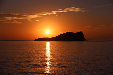 silhouette of island during golden hour thumbnail