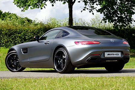 grey Mercedes-Benz coupe parked near tree during daytime thumbnail