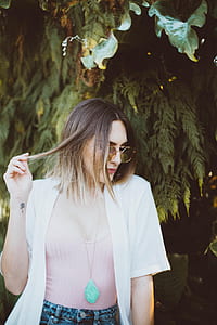 photo of woman holding her hair thumbnail