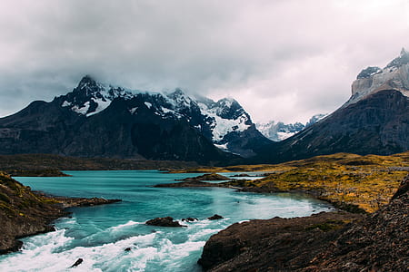 body of water near mountain thumbnail