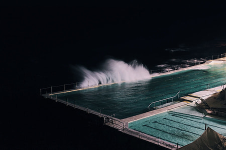 pool near beach side photo during night time thumbnail
