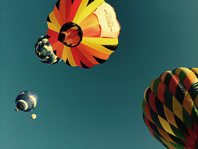 low angle photography of four hot air balloons thumbnail
