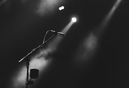 microphone with stand grayscale photography thumbnail
