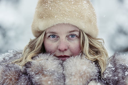 woman taking photo on snow thumbnail