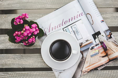 white ceramic teacup with white saucer on magazine thumbnail