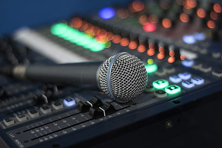 selective focus photography of microphone on audio equalizere thumbnail
