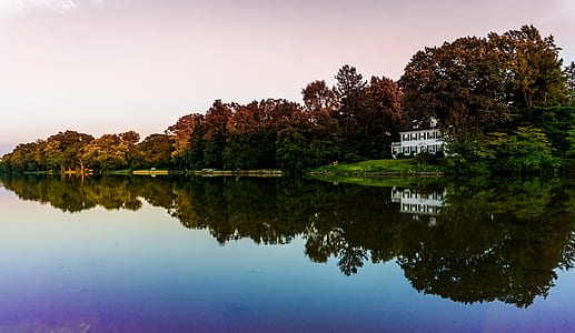 white house near body of water thumbnail