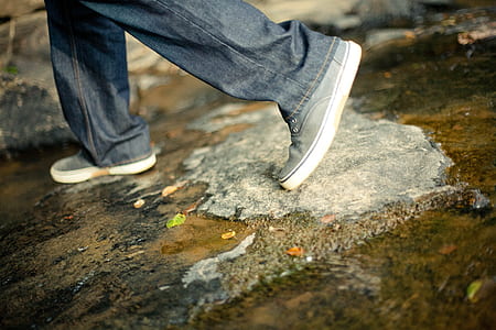 man stepping on pavement thumbnail