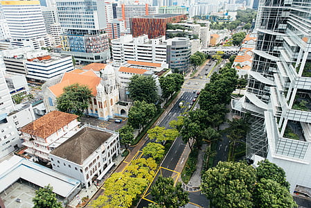vehicle travelling on asphalt road in city thumbnail