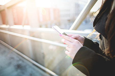 Girl with iPhone 6 in Sunlights thumbnail