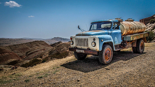water container truck on dirt road thumbnail