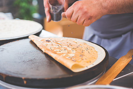 Old Man Making Healthy Crepes in Open Air Market thumbnail