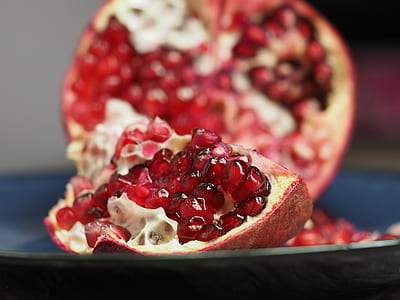 pomegranate fruit in selective focus photography thumbnail