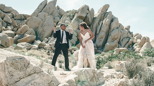 man and woman wearing wedding suits taking a prenup photo thumbnail
